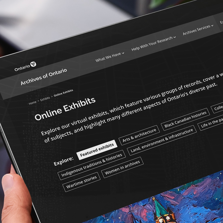 Person on iPad browsing content on Archives of Ontario website