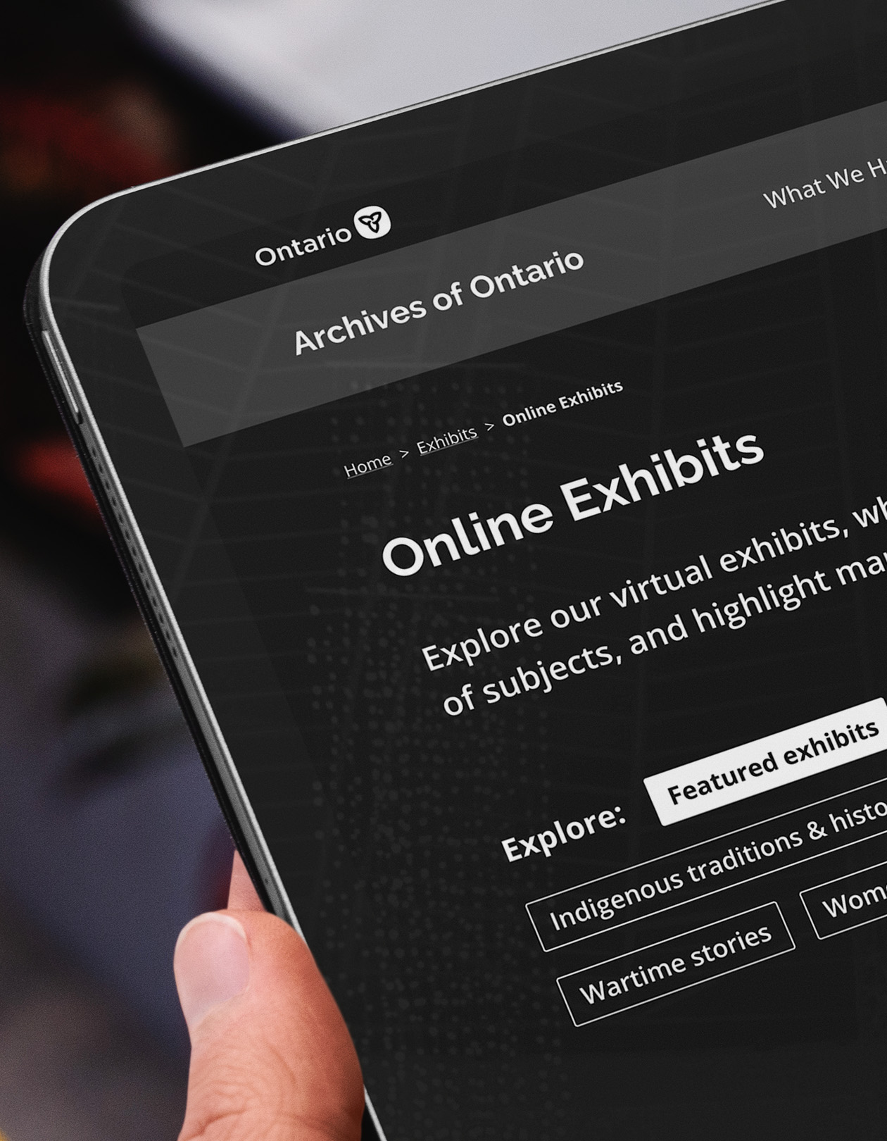 Person on iPad browsing content on Archives of Ontario website